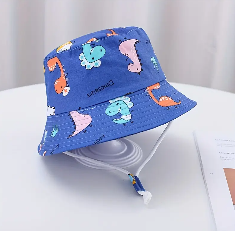 Bonnet enfant à motif dinosaure bleu