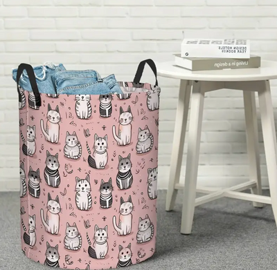 Pink laundry basket with cats